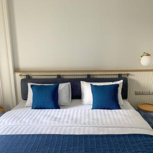 Un pat sau paturi într-o cameră la Blu 395
