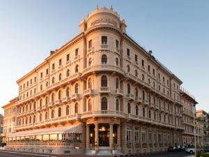 a large building on the corner of a street at Grand Hotel Principe Di Piemonte in Viareggio