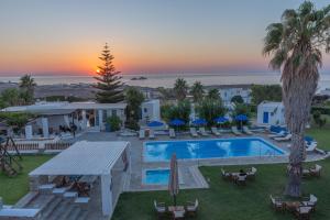 an aerial view of a resort with a swimming pool at Fragoulis Village in Parasporos +37 photos