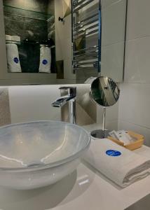 a bathroom with a sink and a mirror on a counter at Mamma Mia Hotel Boutique - Only Adults in Tossa de Mar