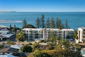 a large building with a view of the ocean at The Norfolks on Moffat Beach in Caloundra