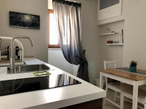 Kuchyň nebo kuchyňský kout v ubytování B&B Al Gravattone + 9 fotografií