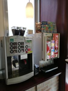 a counter with two microwaves and a microwave at Urbain Hiroshima Central in Hiroshima