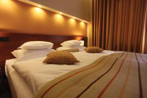 Cama ou camas em um quarto em Hotel Central