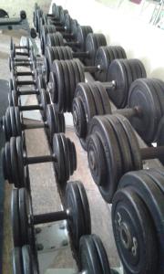 a row of dumbbells lined up in a gym at Wohnung in Leipzig