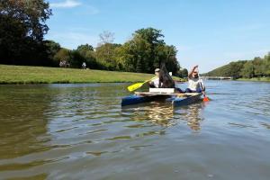 two people in a kayak on a lake at Wohnung in Leipzig +2 photos