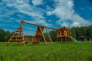 a playground with two swings and a slide at Saules sēta 