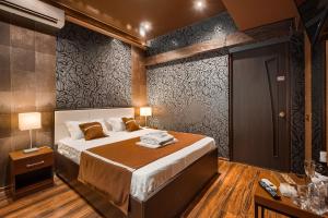 
Кровать или кровати в номере Отель Манго
