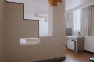 TV a/nebo společenská místnost v ubytování Tong Hsin Hotel