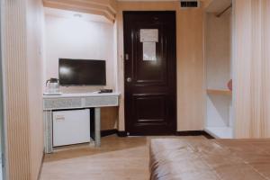 TV a/nebo společenská místnost v ubytování Tong Hsin Hotel