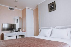 Postel nebo postele na pokoji v ubytování Tong Hsin Hotel