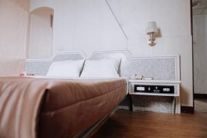 Postel nebo postele na pokoji v ubytování Tong Hsin Hotel