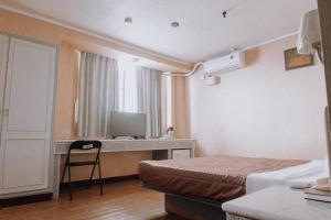 TV a/nebo společenská místnost v ubytování Tong Hsin Hotel