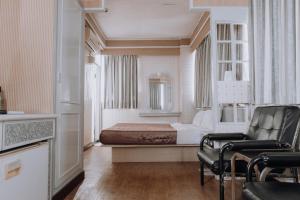 Postel nebo postele na pokoji v ubytování Tong Hsin Hotel