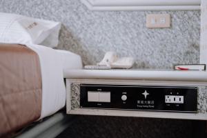 Postel nebo postele na pokoji v ubytování Tong Hsin Hotel