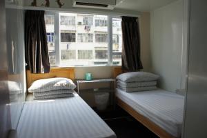 Postel nebo postele na pokoji v ubytování Ocean Inn