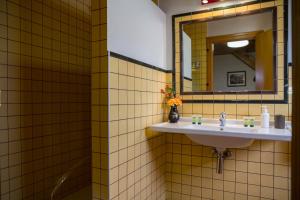 a bathroom with a sink and a mirror at Casa rural Lucuj in Jaurrieta