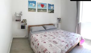 Una cama o camas en una habitación de La Villa BIANCA