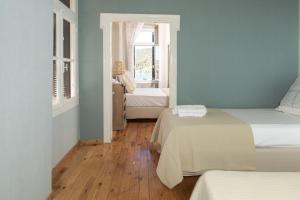 A bed or beds in a room at Neoclassical manor house
