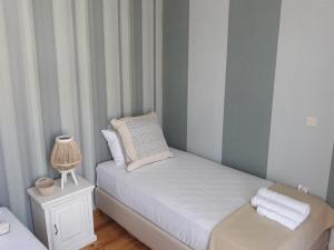 A bed or beds in a room at Neoclassical manor house