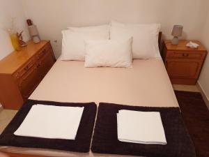 Cama ou camas em um quarto em Ana