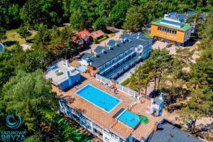 an aerial view of a resort with two pools at Lazurowa Bryza in Poddąbie