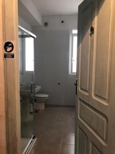 a bathroom with a toilet and a sink at Albergue San Martin in Tui