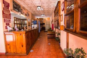 a hallway of a restaurant with a counter and a counter sidx sidx sidx at Hotel De Talavera in Puebla