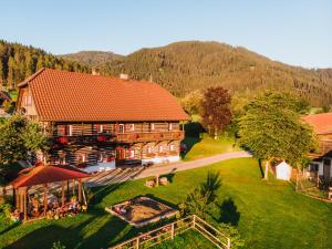 an aerial view of a large wooden house in the mountains at Nagerhof in Gnesau