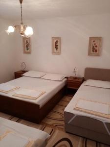 Postel nebo postele na pokoji v ubytování Apartment Dada 2 + 11 fotografií