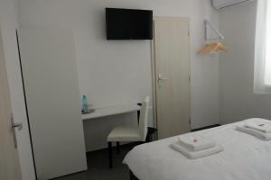 A bed or beds in a room at Penzión pod brezami**