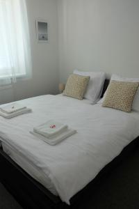 A bed or beds in a room at Penzión pod brezami**