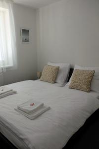 A bed or beds in a room at Penzión pod brezami**