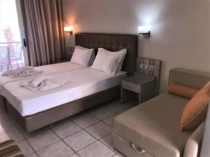 Postel nebo postele na pokoji v ubytování Palm Trees Hotel