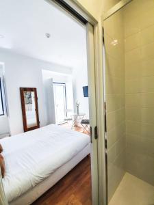 Кровать или кровати в номере PÊPA Guesthouse