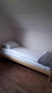 En eller flere senge i et værelse på Domek Ga-Ba