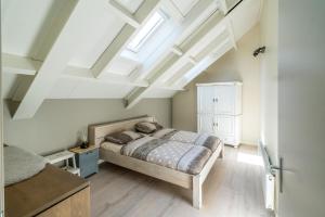 Кровать или кровати в номере Job Baster Huisje