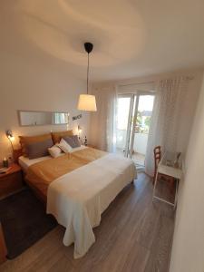 Postel nebo postele na pokoji v ubytování Apartments RELAX 1
