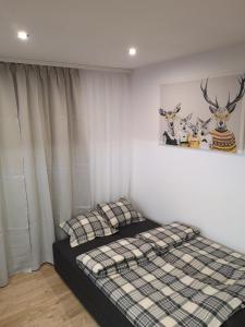Posteľ alebo postele v izbe v ubytovaní Apartament Izerski Raj