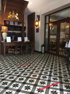 a room with a black and white floor with stars on it at Campbell House in George Town