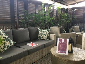 a couch with a star on it in a room with plants at Campbell House in George Town