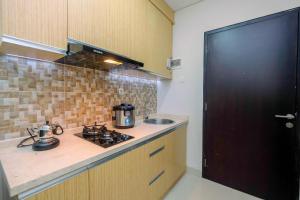 Η κουζίνα ή μικρή κουζίνα στο Enjoy 1BR Apartment at Atlanta Residence By Travelio