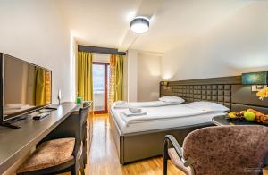 Postel nebo postele na pokoji v ubytování Tino Hotel & SPA + 37 fotografií
