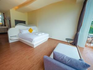 Postel nebo postele na pokoji v ubytování De VeraNiO Resort