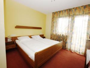 Postel nebo postele na pokoji v ubytování Hotel Bären Garni