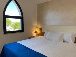 Postel nebo postele na pokoji v ubytování La Rustica Hotel + 18 fotografií