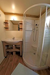 a bathroom with a shower and a sink at Camping Torraccia in Cargèse