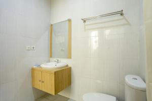 Koupelna v ubytování IDR Green Guest House Syariah Mitra RedDoorz + 37 fotografií