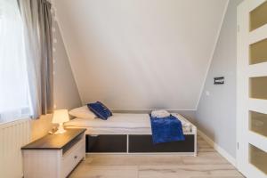 Posteľ alebo postele v izbe v ubytovaní ApartamentyGdanske EU - Golden