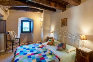 Postel nebo postele na pokoji v ubytování Borgo Case Lucidi relax